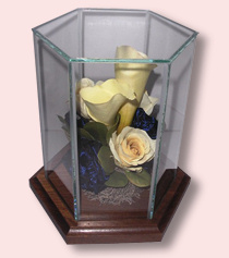 preserved yellow flowers in glass hexagon