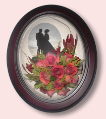 silhouetted couple with red roses