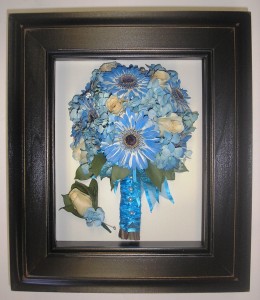 Dried bouquet.  Notice the blue flowers look as blue as they did on her wedding day.  Beautiful!