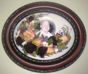 Dried flowers refurbished and encased with a photo