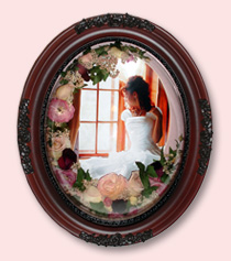 preserved wedding flowers in arc around photo of bride on wedding day