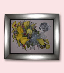 preservation of yellow bouquet in cascading design in silver frame
