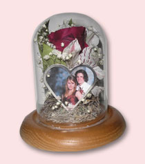 corsage preserved in table dome with photo of couple at prom