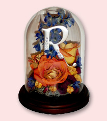 table dome with flowers preserved with silver letter initial