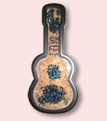 guitar shaped custom shadow box with preserved floral art creating the guitar