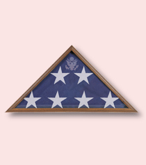 military casket flag displayed in triangle shadow box