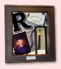 shadow box with photo of graduate and memorabilia