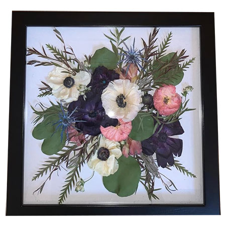 Multi colored pressed flowers in black frame