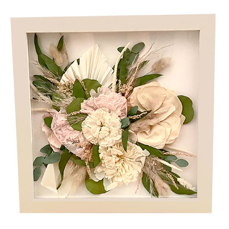 Pressed bouquet with pink and yellow roses and greenery