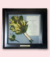 yellow preserved bouquet and invitation in sleek square black frame encasement with engraving