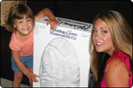 Mom and young daughter with preserved wedding gown