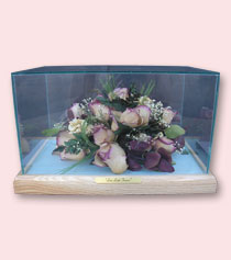 glass box with dried roses